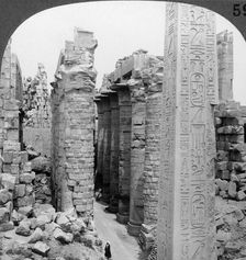 Middle aisle of the great hall and obelisk of Thutmosis I, temple at Karnak, Thebes, Egypt 1905.Artist: Underwood & Underwood