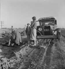 Migratory agricultrual worker family along California highway, U.S. 99, 1937. Creator: Dorothea Lange