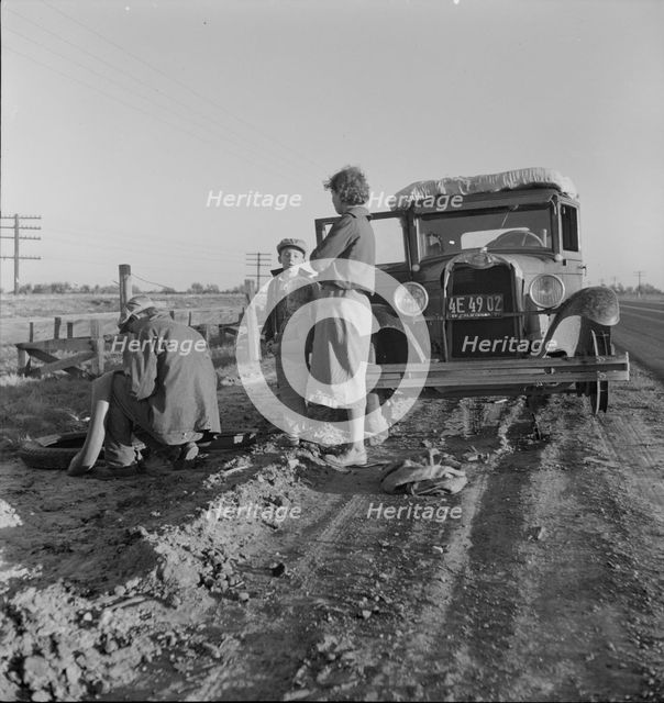 Migratory agricultrual worker family along California highway, U.S. 99, 1937. Creator: Dorothea Lange.