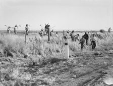 Migratory agricultural workers - cotton hoers, near Los Banos, California, 1939. Creator: Dorothea Lange