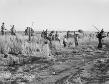 Migratory agricultural workers - cotton hoers, near Los Banos, California, 1939. Creator: Dorothea Lange