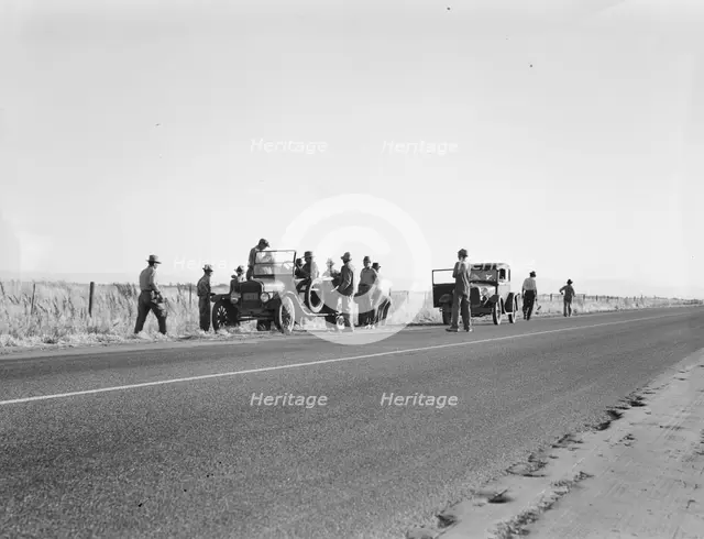Migratory agricultural workers - cotton hoers, near Los Banos, California, 1939. Creator: Dorothea Lange.