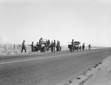 Migratory agricultural workers - cotton hoers, near Los Banos, California, 1939. Creator: Dorothea Lange