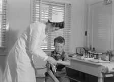 Migratory boys come to the clinic for attention, FSA camp at Farmersville, Tulare County, 1939. Creator: Dorothea Lange