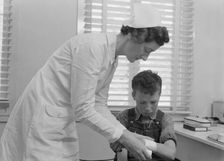 Migratory boys come to clinic for attention, FSA camp at Farmersville, Tulare County, 1939. Creator: Dorothea Lange