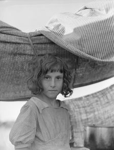 Migratory child in camp at end of day, Bean pickers camp near West Stayton, Oregon, 1939. Creator: Dorothea Lange