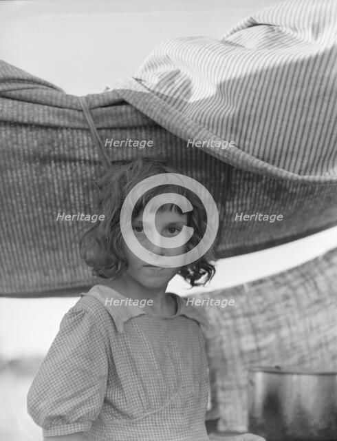 Migratory child in camp at end of day, Bean pickers' camp near West Stayton, Oregon, 1939. Creator: Dorothea Lange.