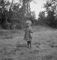 Migratory child in squatter camp before hop season opens, Washington, Yakima Valley, 1939. Creator: Dorothea Lange