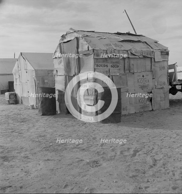 Migratory field worker's home on the edge of a pea field, Imperial Valley, California, 1937. Creator: Dorothea Lange.