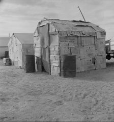 Migratory field worker's home on the edge of a pea field, Imperial Valley, California, 1937. Creator: Dorothea Lange