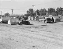 Migratory labor housing during carrot harvest, near Holtville, Imperial Valley, California, 1939. Creator: Dorothea Lange