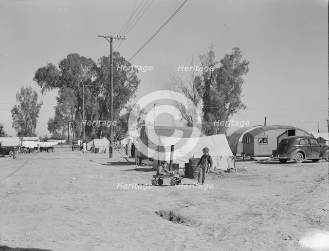 Migratory labor housing during carrot harvest, near Holtville, Imperial Valley, California , 1939. Creator: Dorothea Lange.