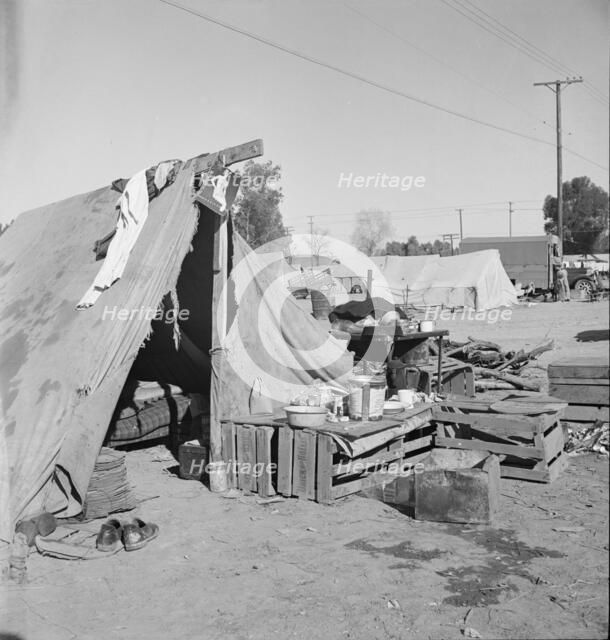 Migratory labor housing during carrot harvest, near Holtville, Imperial Valley, California, 1939. Creator: Dorothea Lange.