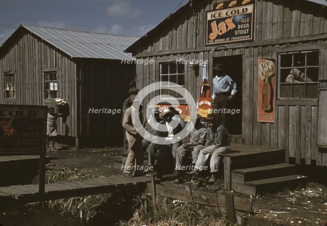 Migratory laborers outside of a "juke joint" during a slack season, Belle Glade, Fla., 1941. Creator: Marion Post Wolcott.
