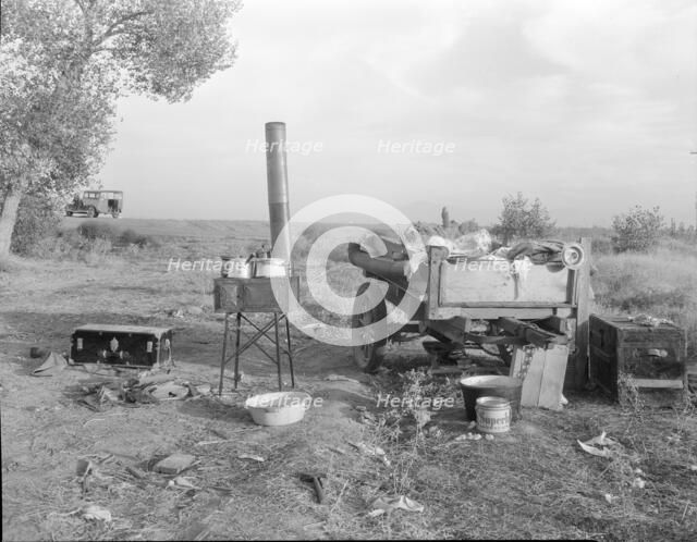 Migratory workers' "kitchen" near Shafter, Kern County, California, 1936. Creator: Dorothea Lange.