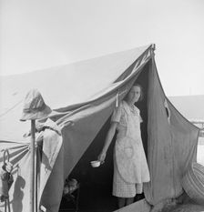 Migrant woman from Arkansas living in contractor's camp near Westley, California, 1939. Creator: Dorothea Lange