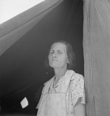 Migrant woman from Arkansas living in contractor's camp near Westley, California, 1939. Creator: Dorothea Lange