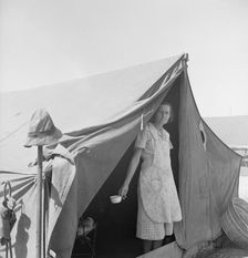 Migrant woman from Arkansas living in contractor's camp near Westley, California, 1939. Creator: Dorothea Lange