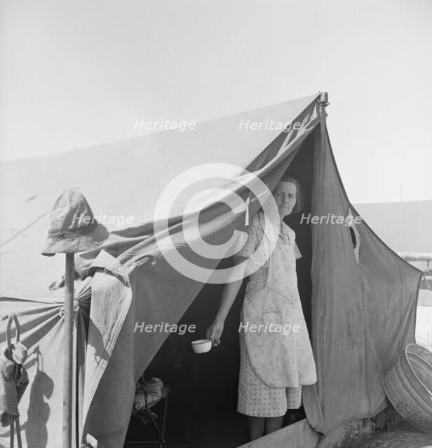 Migrant woman from Arkansas living in contractor's camp near Westley, California, 1939. Creator: Dorothea Lange.