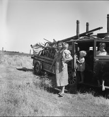 Migrant agricultural labor family, refugees from Texas, near Wasco, California, 1938. Creator: Dorothea Lange