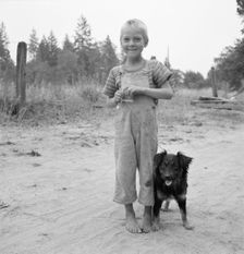 Migrant boy, family, live in grower's camp for..., near Grants pass, Josephine County, Oregon, 1939. Creator: Dorothea Lange