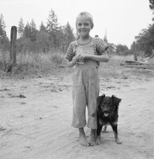 Migrant boy, family, live in grower's camp for..., near Grants pass, Josephine County, Oregon, 1939. Creator: Dorothea Lange