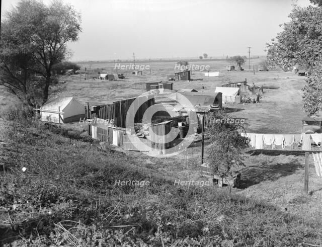 Migrant camp on the outskirts of Sacramento, California on the American River, 1936. Creator: Dorothea Lange.