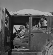 Migrant children from Oklahoma on California highway, 1937. Creator: Dorothea Lange