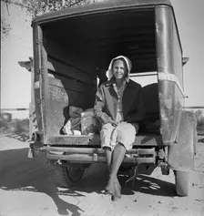 Migrant cotton picker on way to field, Kern migrant camp, California, 1936. Creator: Dorothea Lange