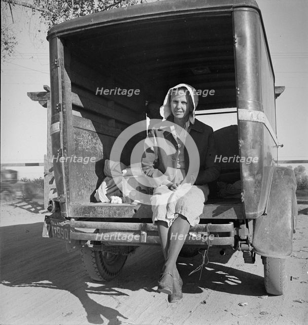 Migrant cotton picker on way to field, Kern migrant camp, California, 1936. Creator: Dorothea Lange.