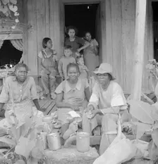Migrant cotton pickers at lunchtime, near Radstown, Texas, 1936. Creator: Dorothea Lange