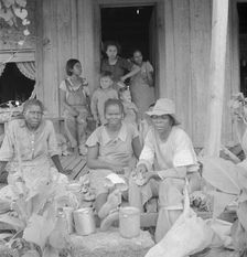 Migrant cotton pickers at lunchtime, near Radstown, Texas, 1936. Creator: Dorothea Lange