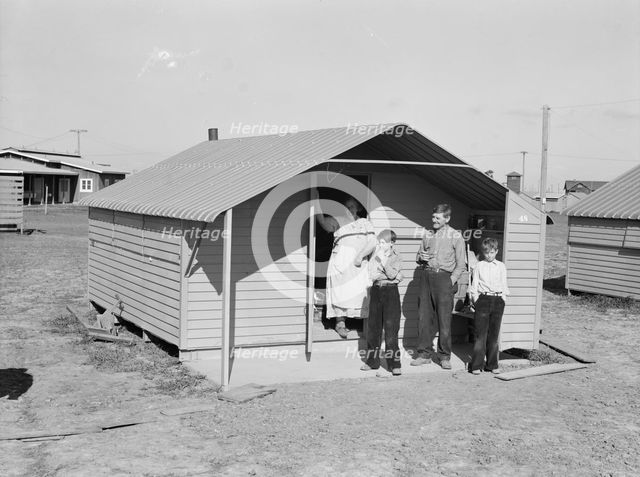 Migrant family from Oklahoma, first occupants of Westley camp, California, 1939. Creator: Dorothea Lange.