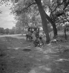 Migrant family from Oklahoma in Texas, alongside the road, 1936. Creator: Dorothea Lange
