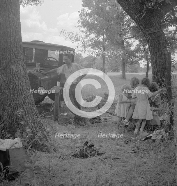 Migrant family from Oklahoma in Texas, alongside the road, 1936. Creator: Dorothea Lange.