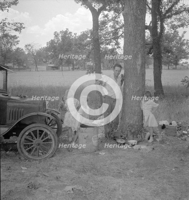 Migrant family from Oklahoma in Texas, alongside the road, 1936. Creator: Dorothea Lange.