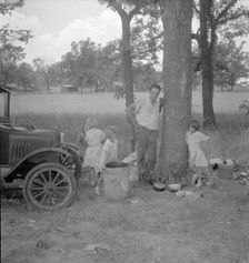 Migrant family from Oklahoma in Texas, alongside the road, 1936. Creator: Dorothea Lange