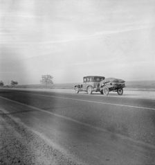 Migrant family on U.S. Highway 99 between Bakersfield and Famoso, California, 1936. Creator: Dorothea Lange