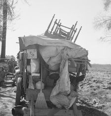 Migrant family outfit on U.S. 99 between Bakersfield, California, and the Ridge, 1939. Creator: Dorothea Lange