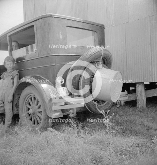Migrant family's car near Brownsville, Texas, 1936. Creator: Dorothea Lange.