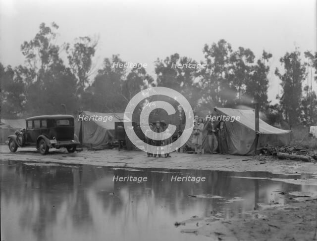 Migrant pea pickers camp in the rain, California, 1936. Creator: Dorothea Lange.