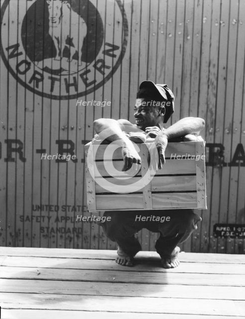 Migrant shed worker, Northeast Florida, 1936. Creator: Dorothea Lange.