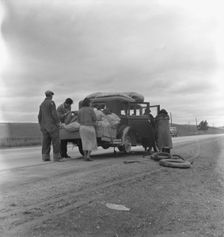 Migrants, family of Mexicans, on road with tire trouble, looking for work..., CA, 1936. Creator: Dorothea Lange