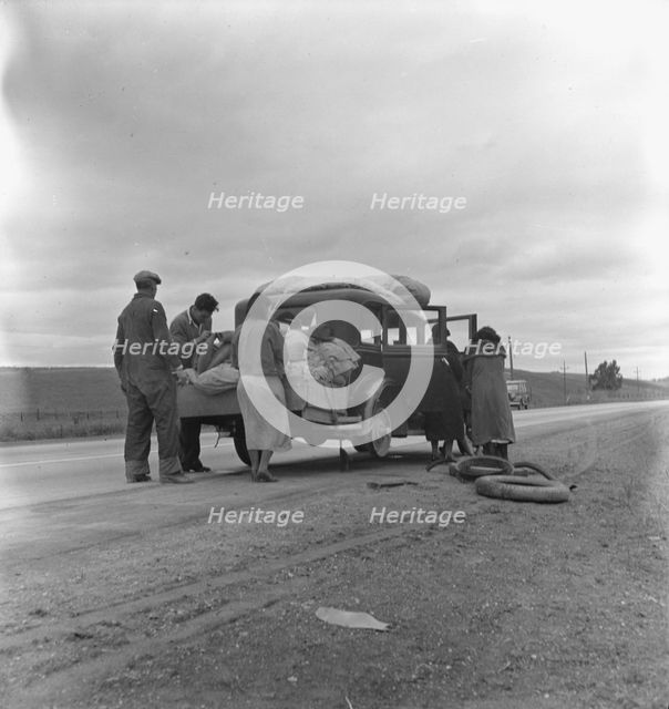 Migrants, family of Mexicans, on road with tire trouble, looking for work..., CA, 1936. Creator: Dorothea Lange.