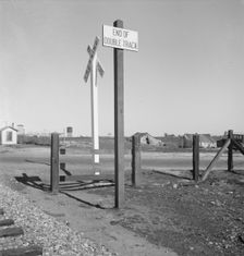 Migrants tents...along the right of way of the southern pacific, near Fresno, California, 1939. Creator: Dorothea Lange