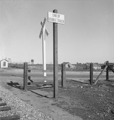 Migrants tents...along the right of way of the southern pacific, near Fresno, California, 1939. Creator: Dorothea Lange