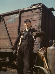 Mike Evans, a welder, at the rip tracks at Proviso yard of the C & NW RR, Chicago, Ill., 1943. Creator: Jack Delano