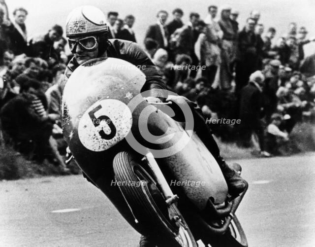 Mike Hailwood, on an MV Agusta, winner of the Isle of Man Senior TT, 1964. Artist: Unknown