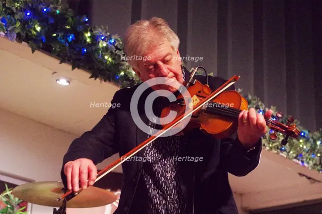 Mike Piggott, East Grinstead Jazz Club, Apron Café, Chequer Mead Theatre, West Sussex, April 2025. Creator: Brian O'Connor.