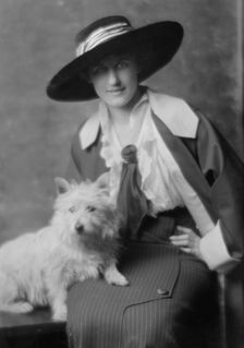 Milholland, Inez (Mrs. Eugene Boissevain), with dog, portrait photograph, 1914. Creator: Arnold Genthe
